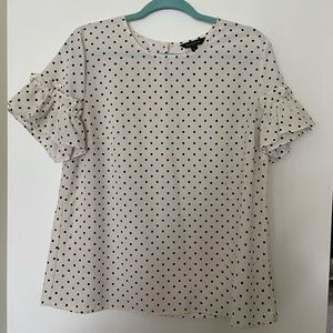 Super cute work blouse with fun ruffle on sleeve!